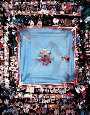 Seven years after being stripped ol his title, Muhammad Ali, champion again at 32. Boxing history is made as Foreman fails to get up from the canvas. The referee was former Harlem Globetrotter, Zack Clayton. photo by Nell Lener